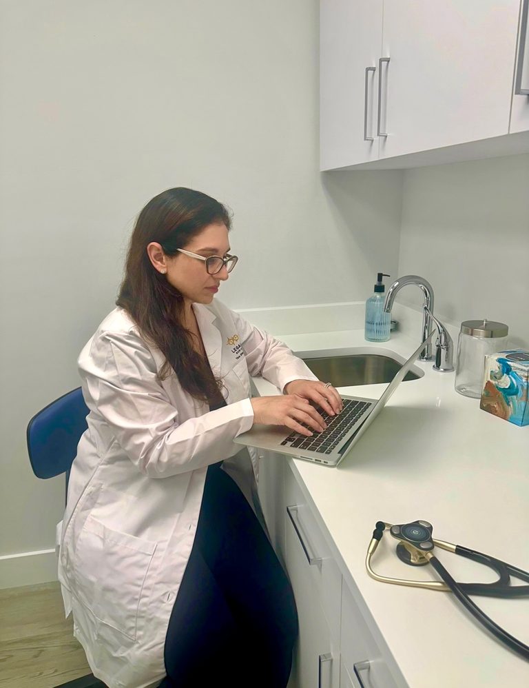 Dr. Yana Shtern working in an exam room